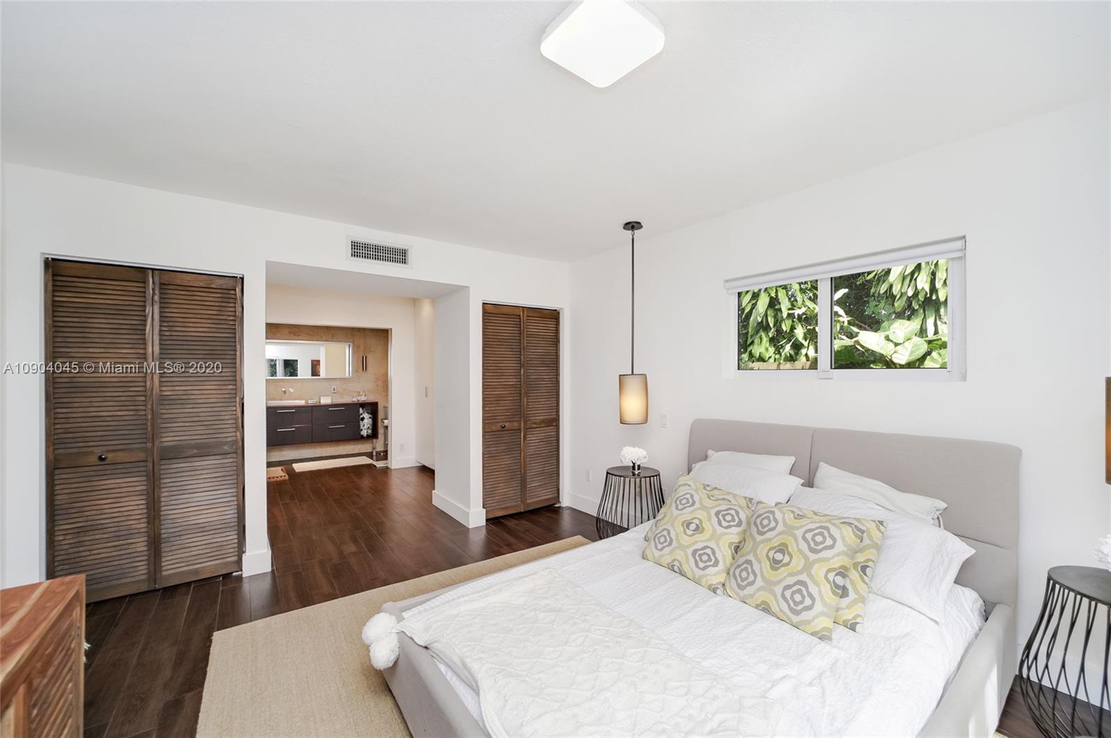 434 Southwest 30th Road Miami, FL 33129 - Photo 18 of 51 a bedroom with a bed and a table