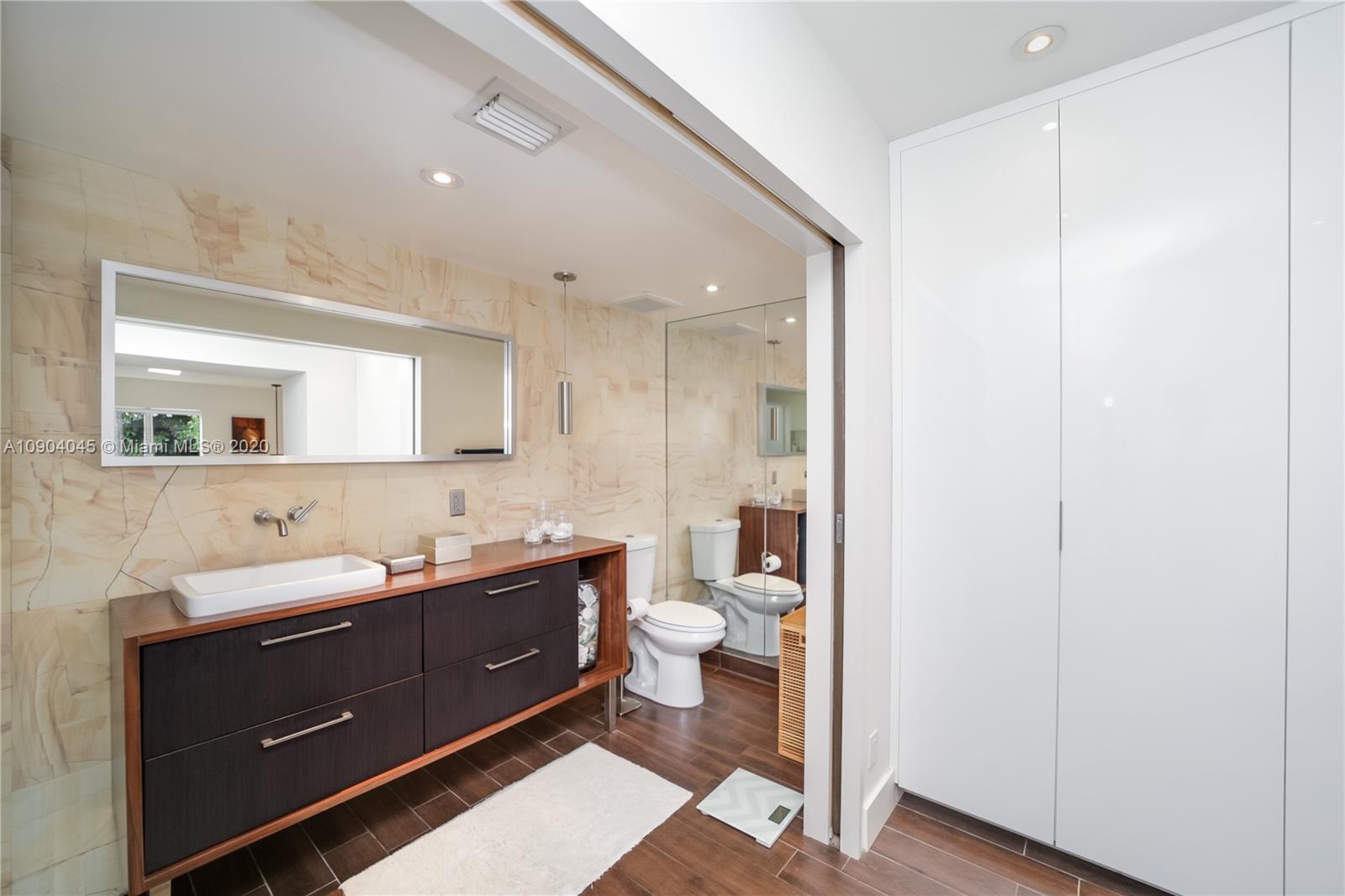 434 Southwest 30th Road Miami, FL 33129 - Photo 20 of 51 a bathroom with a double vanity sink and a mirror