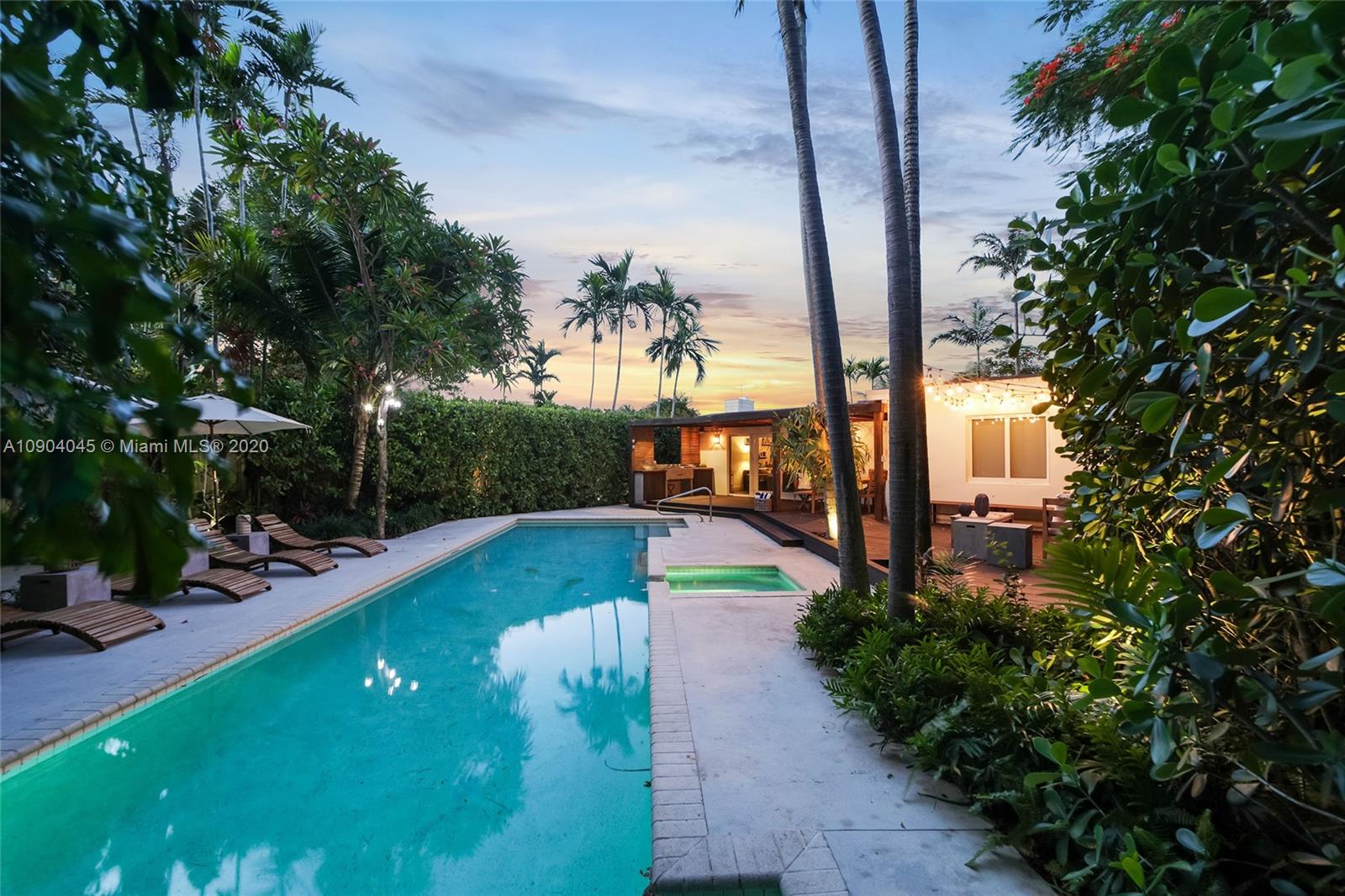 434 Southwest 30th Road Miami, FL 33129 - Photo 2 of 51 a view of a swimming pool with a patio