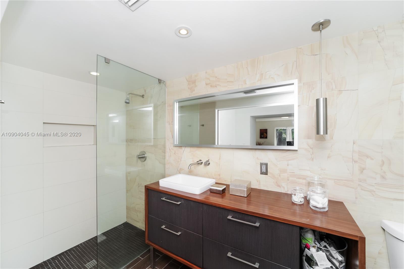 434 Southwest 30th Road Miami, FL 33129 - Photo 21 of 51 a bathroom with a sink mirror and a shower