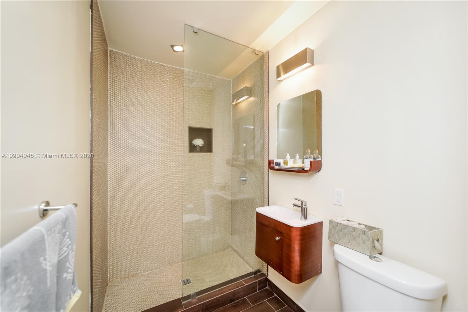 434 Southwest 30th Road Miami, FL 33129 - Photo 29 of 51 a bathroom with a sink mirror vanity and toilet