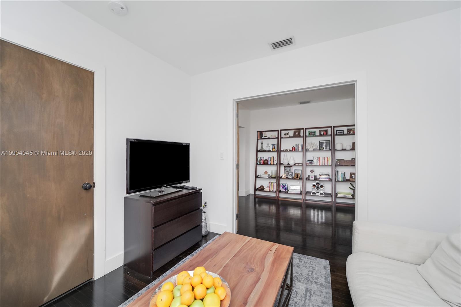 434 Southwest 30th Road Miami, FL 33129 - Photo 33 of 51 a living room with furniture and a flat screen tv