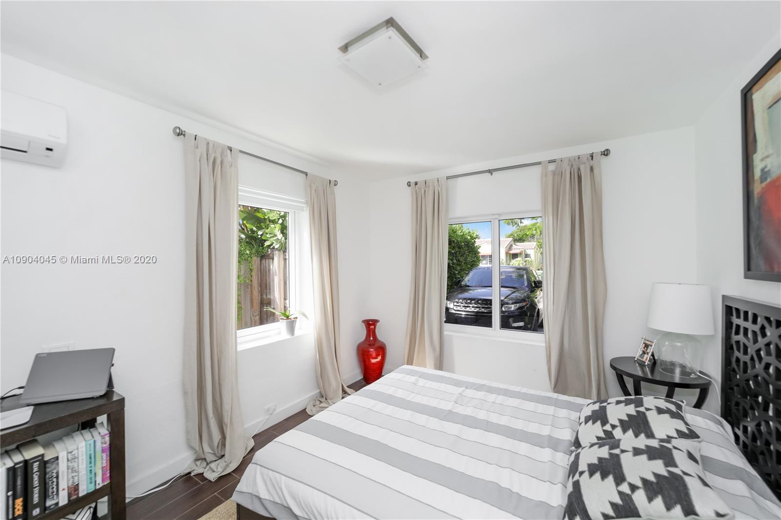 434 Southwest 30th Road Miami, FL 33129 - Photo 35 of 51 a bedroom with a bed and a window