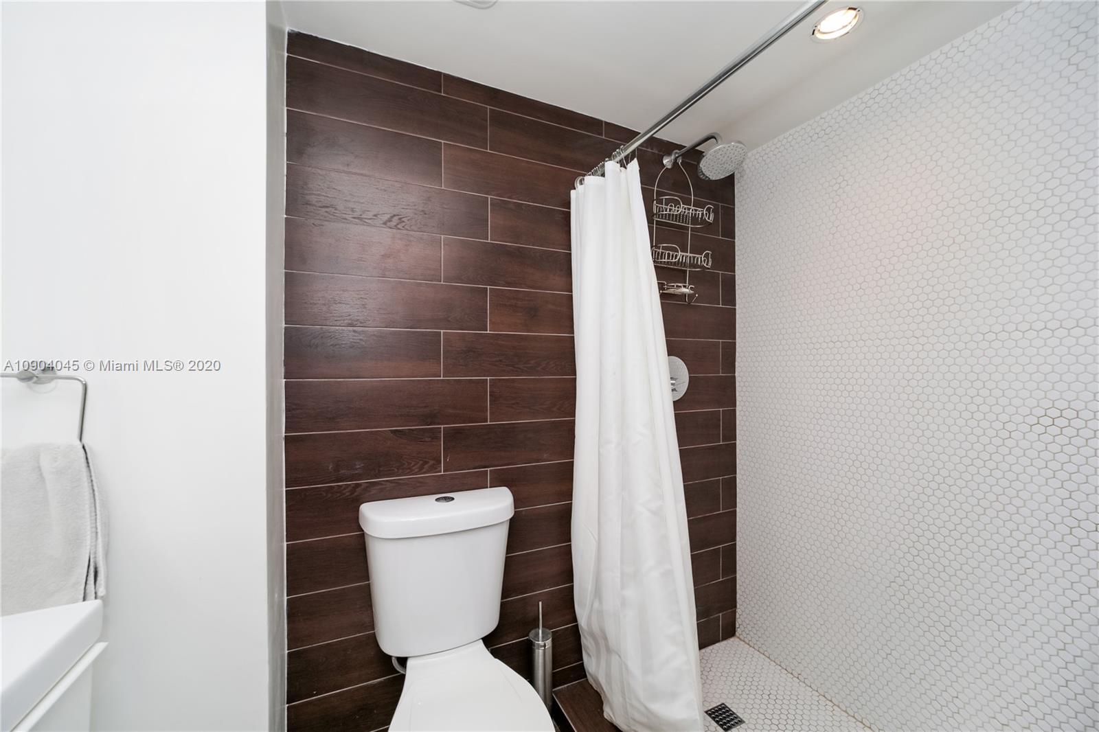 434 Southwest 30th Road Miami, FL 33129 - Photo 38 of 51 a bathroom with a toilet and a shower