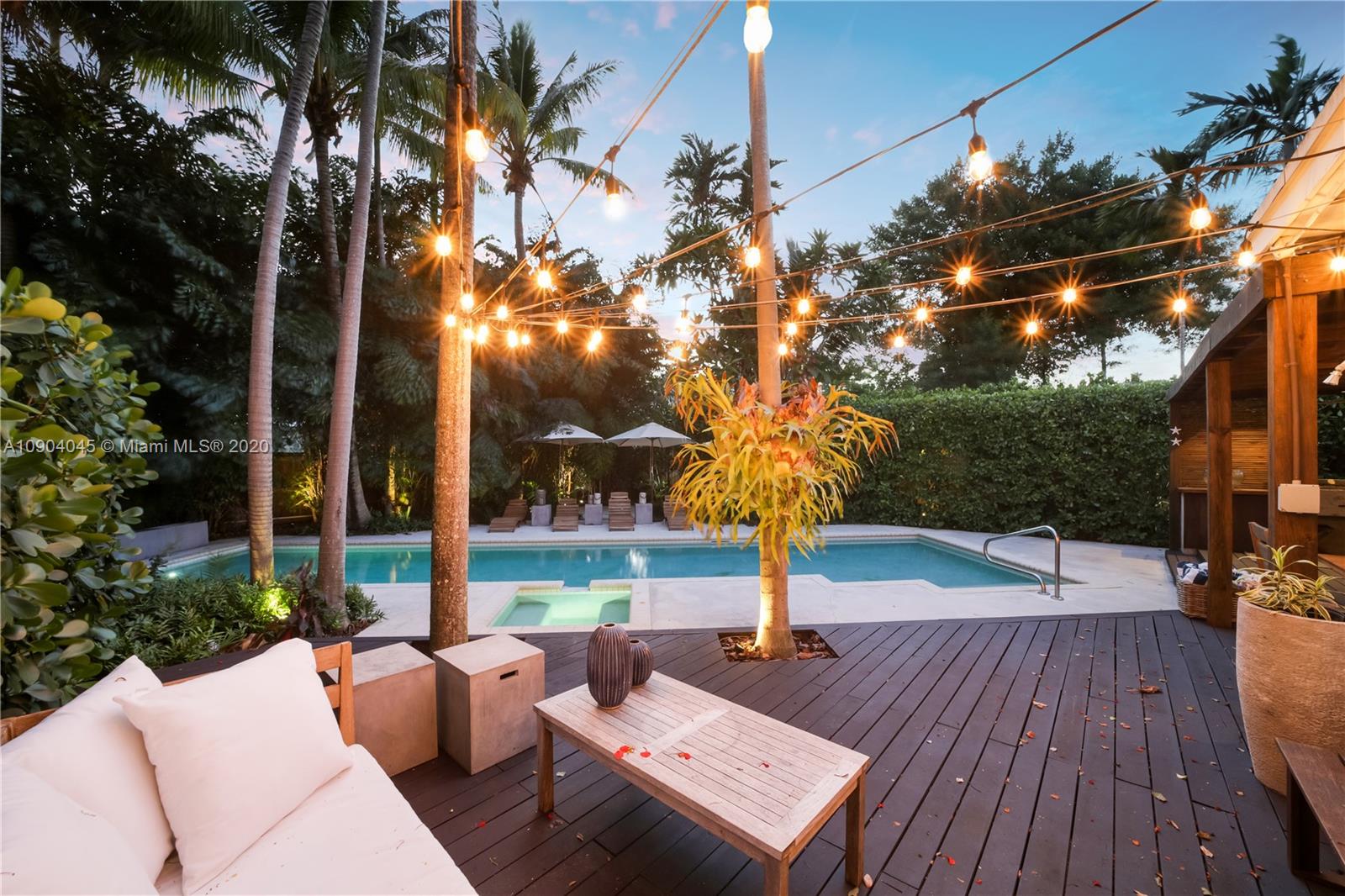 434 Southwest 30th Road Miami, FL 33129 - Photo 44 of 51 a view of a patio with couches and table and chairs with wooden floor and fence