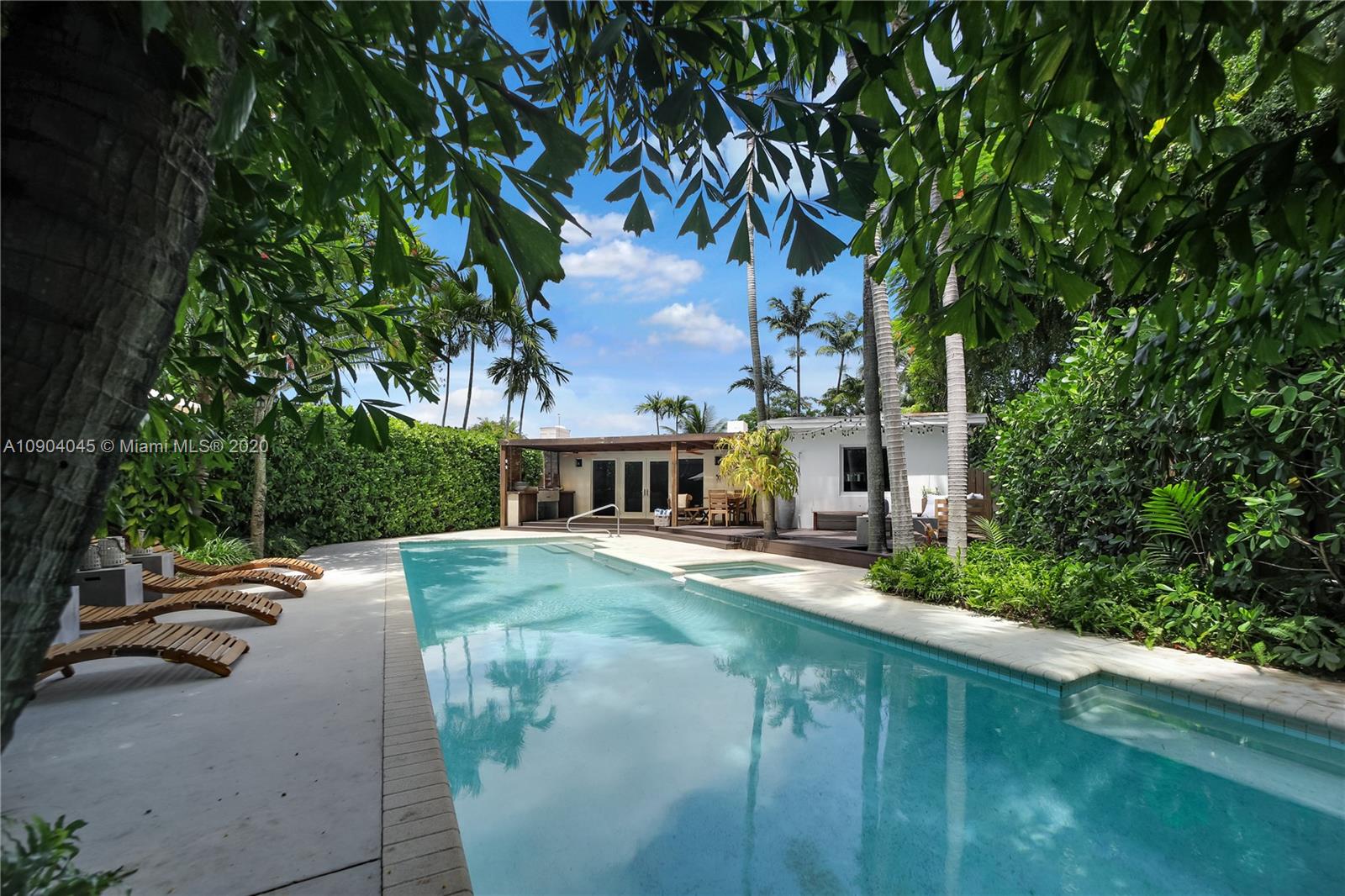 434 Southwest 30th Road Miami, FL 33129 - Photo 5 of 51 a view of a patio with a table and chairs under an umbrella