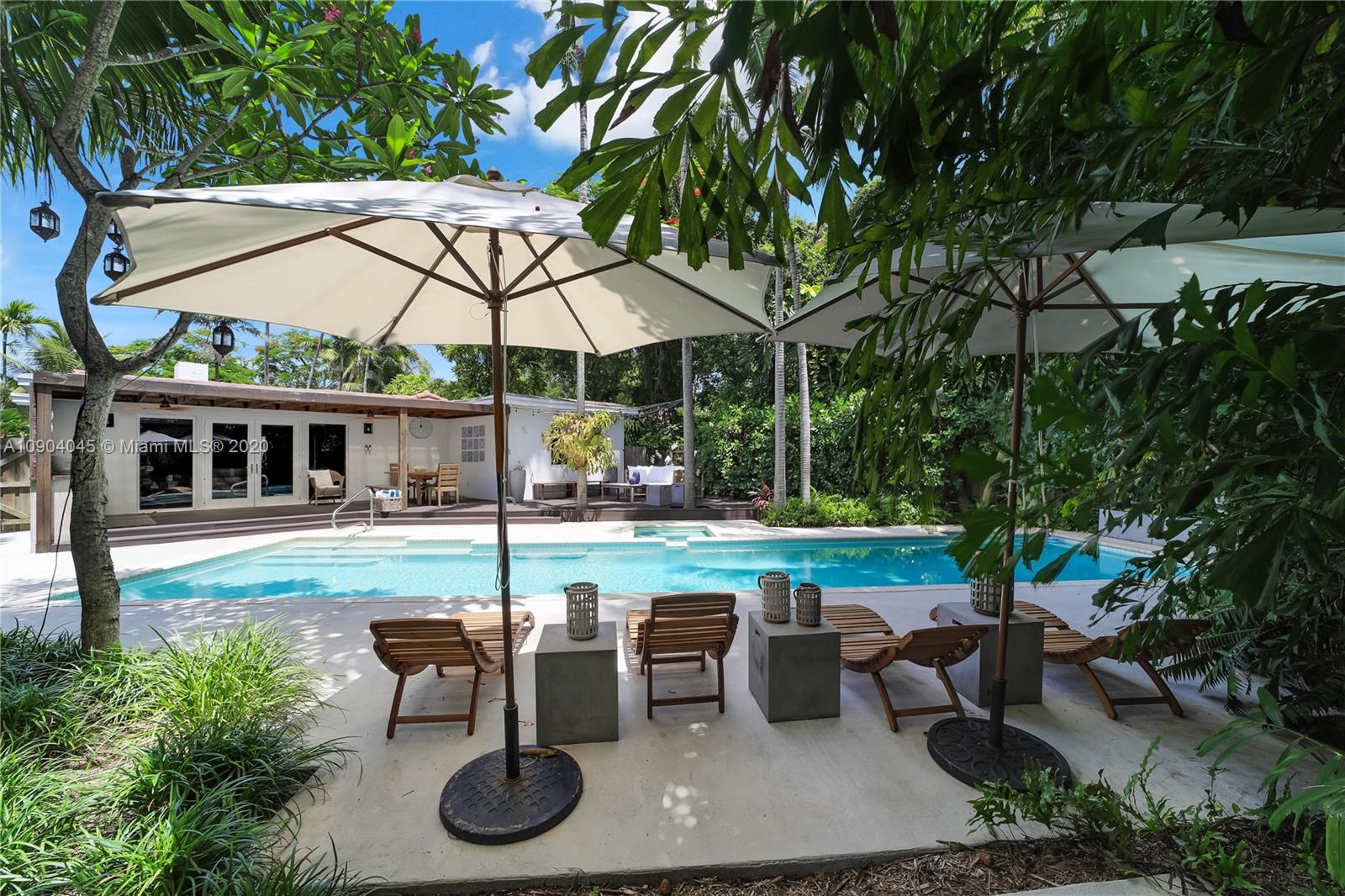 434 Southwest 30th Road Miami, FL 33129 - Photo 7 of 51 a view of a patio with a table chairs and a backyard