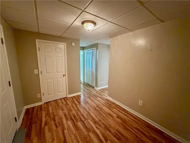 a view of room with wooden floor