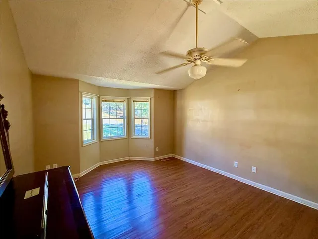 a bathroom with a tub and shower