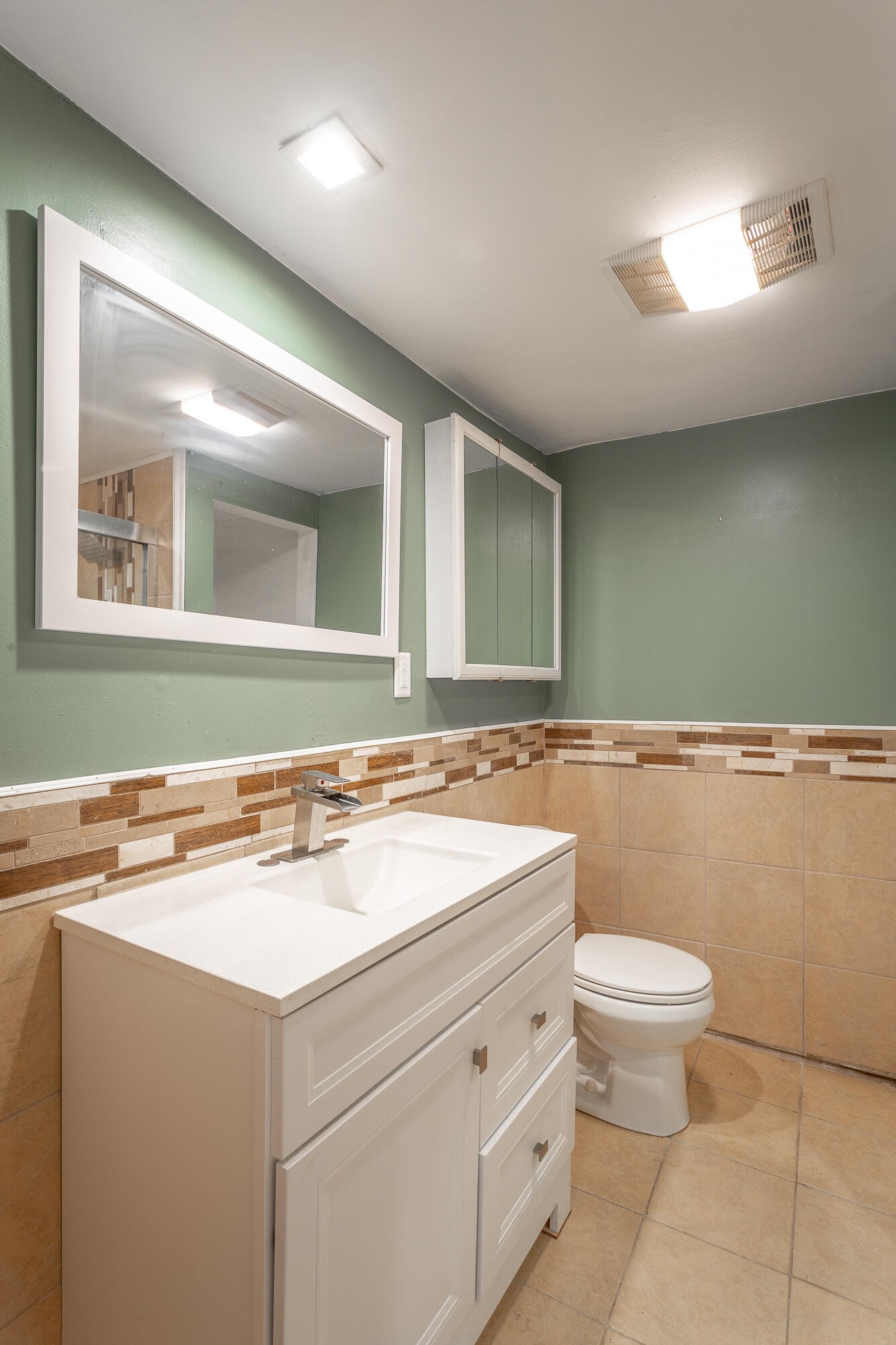 5401 Champion Road Chattanooga, TN 37416 - Photo 22 of 56 a bathroom with a sink a toilet and a mirror