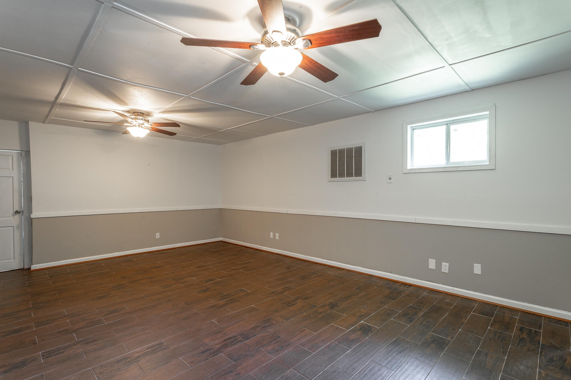 5401 Champion Road Chattanooga, TN 37416 - Photo 30 of 56 an empty room with wooden floor and windows