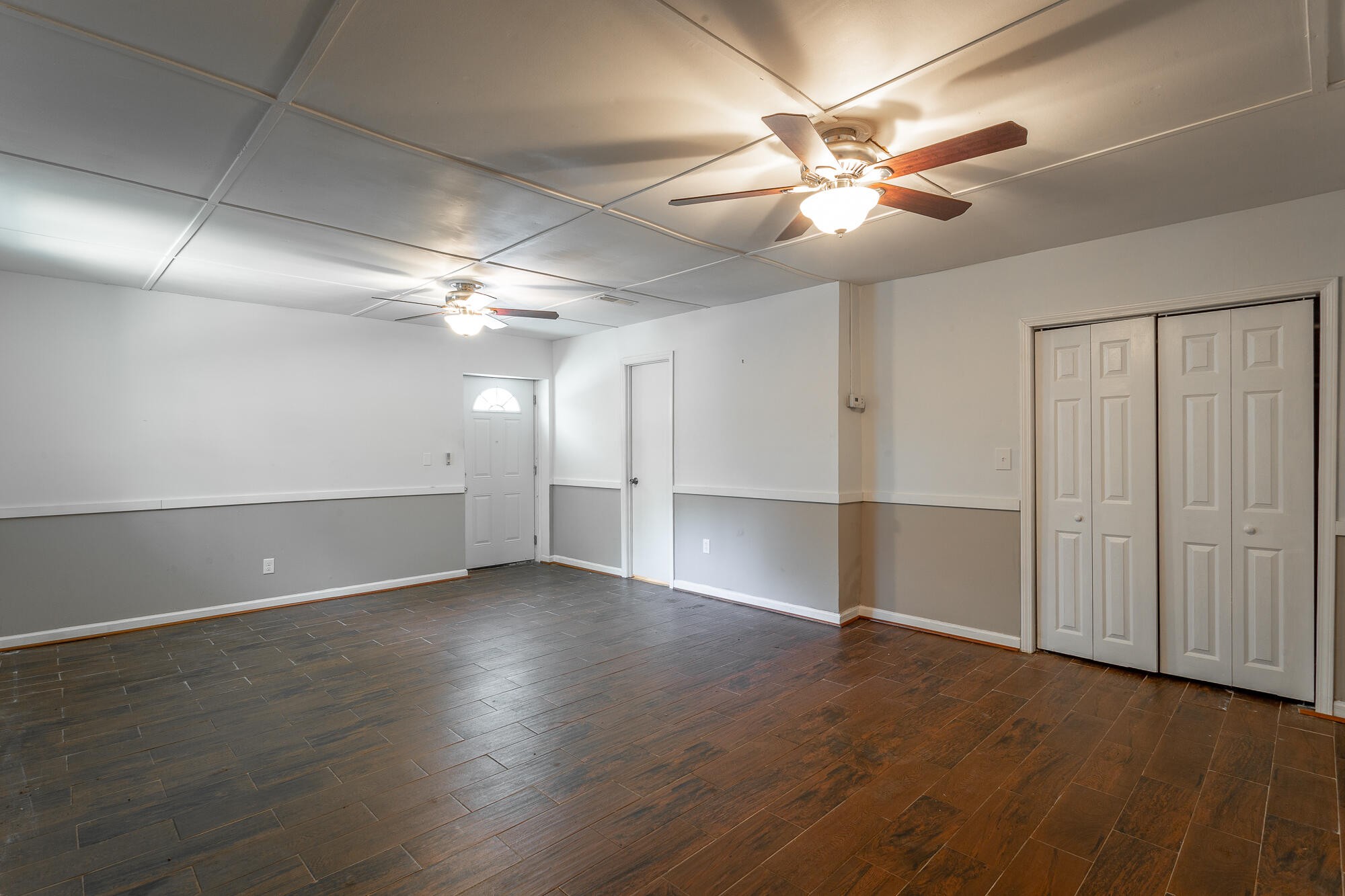 5401 Champion Road Chattanooga, TN 37416 - Photo 32 of 56 an empty room with wooden floor fan and windows
