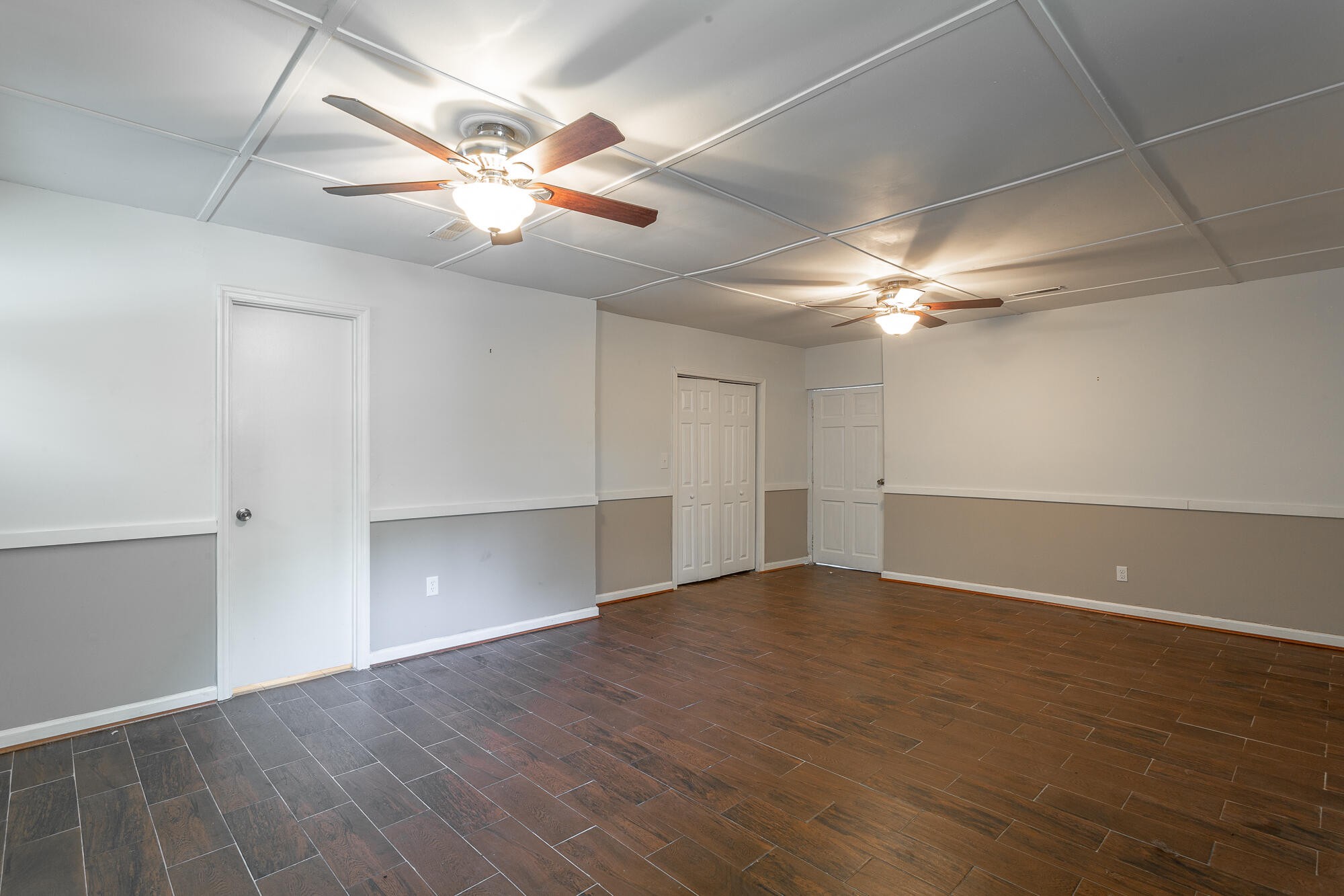 5401 Champion Road Chattanooga, TN 37416 - Photo 33 of 56 an empty room with wooden floor fan and windows