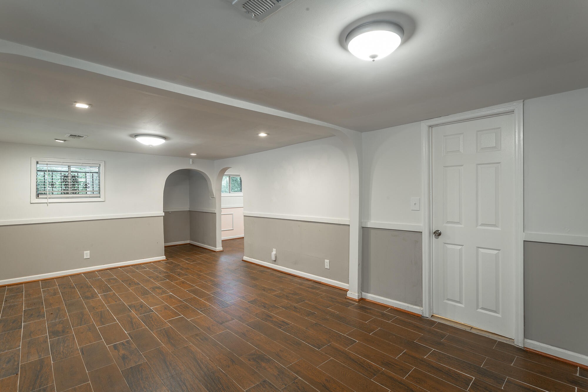 5401 Champion Road Chattanooga, TN 37416 - Photo 4 of 56 an empty room with wooden floor and windows