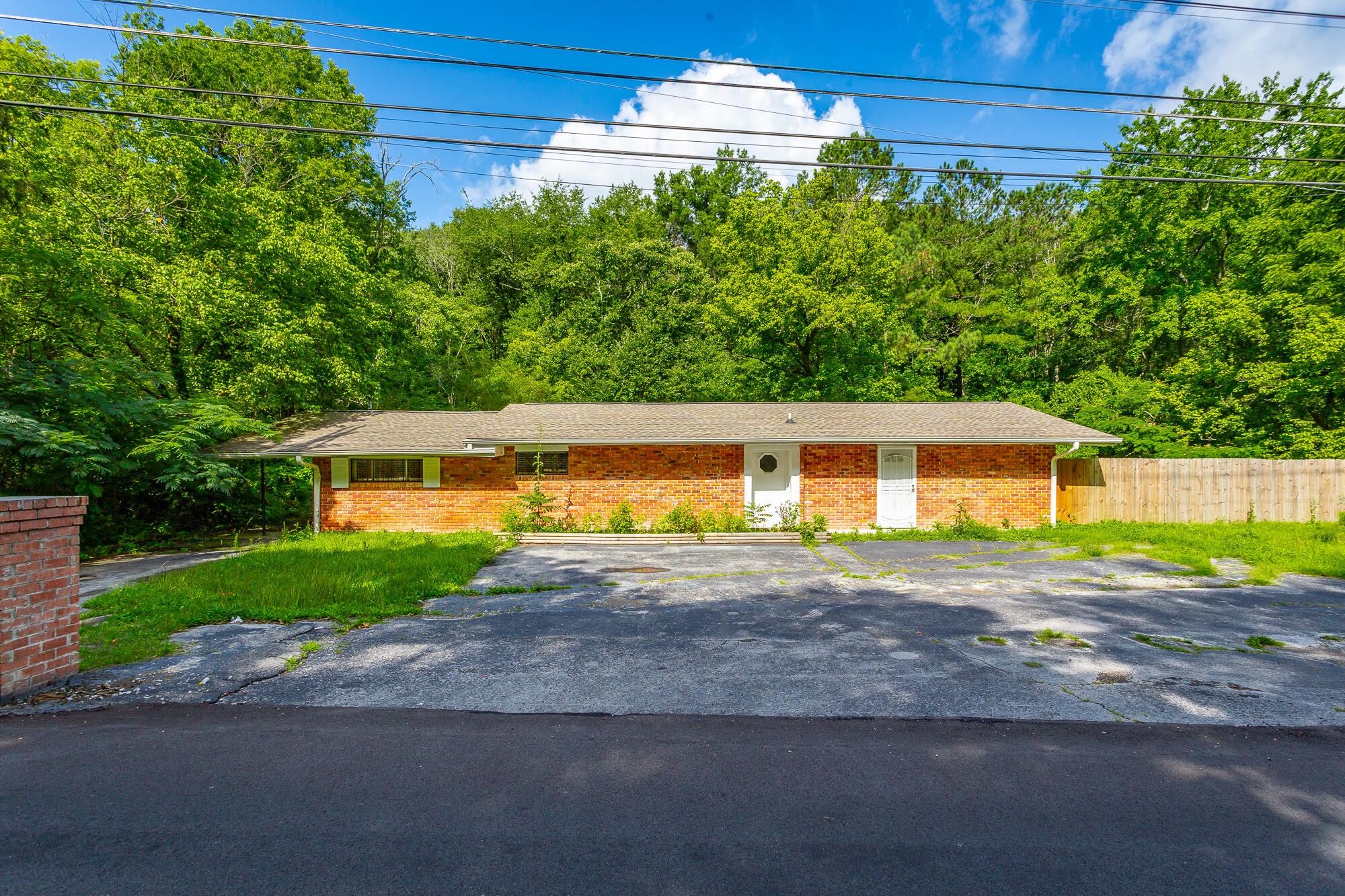 5401 Champion Road Chattanooga, TN 37416 - Photo 43 of 56 a front view of a house with a yard and garage