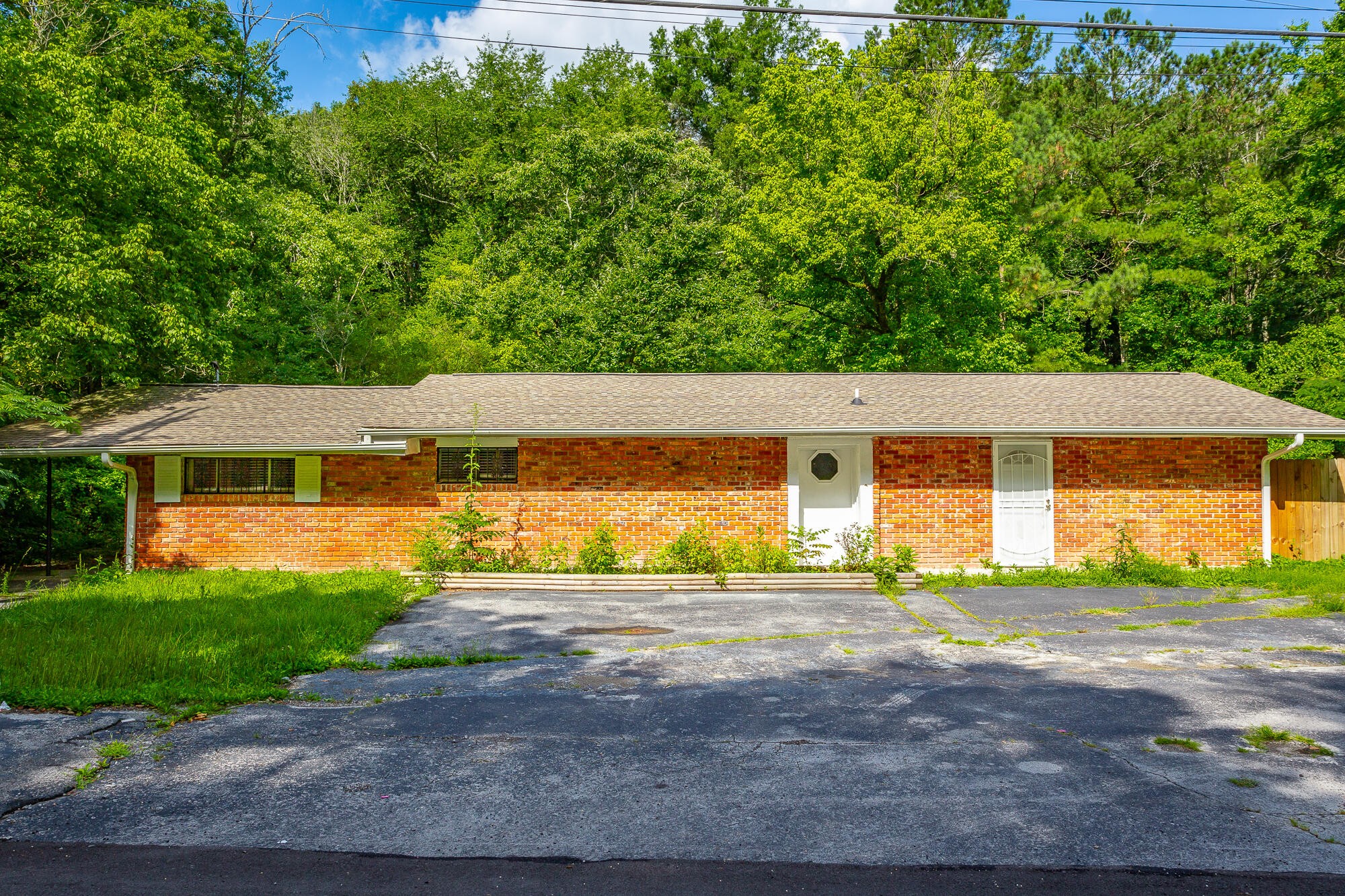 5401 Champion Road Chattanooga, TN 37416 - Photo 44 of 56 a front view of a house with a yard and garage