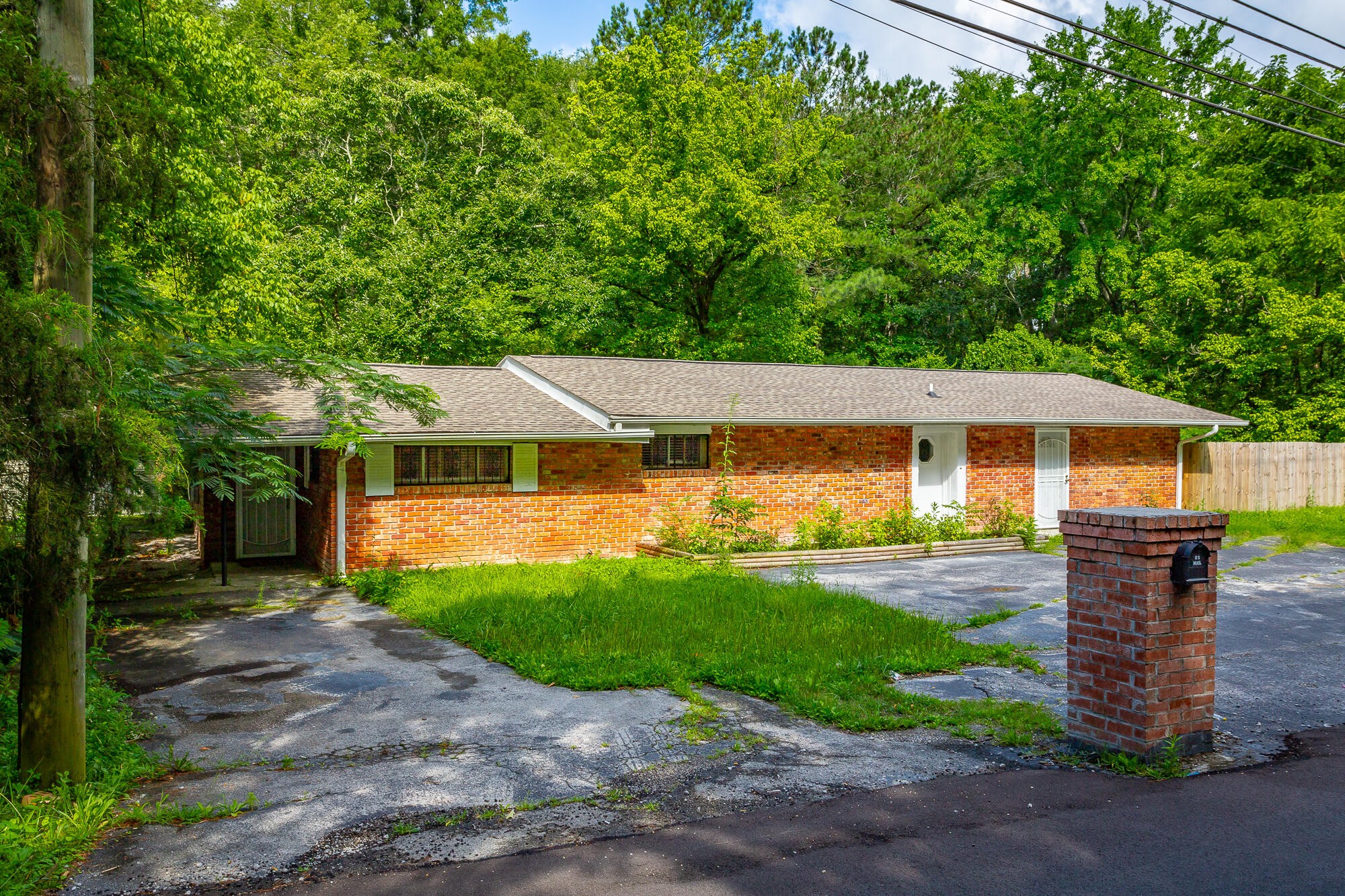 5401 Champion Road Chattanooga, TN 37416 - Photo 47 of 56 a front view of a house with a yard