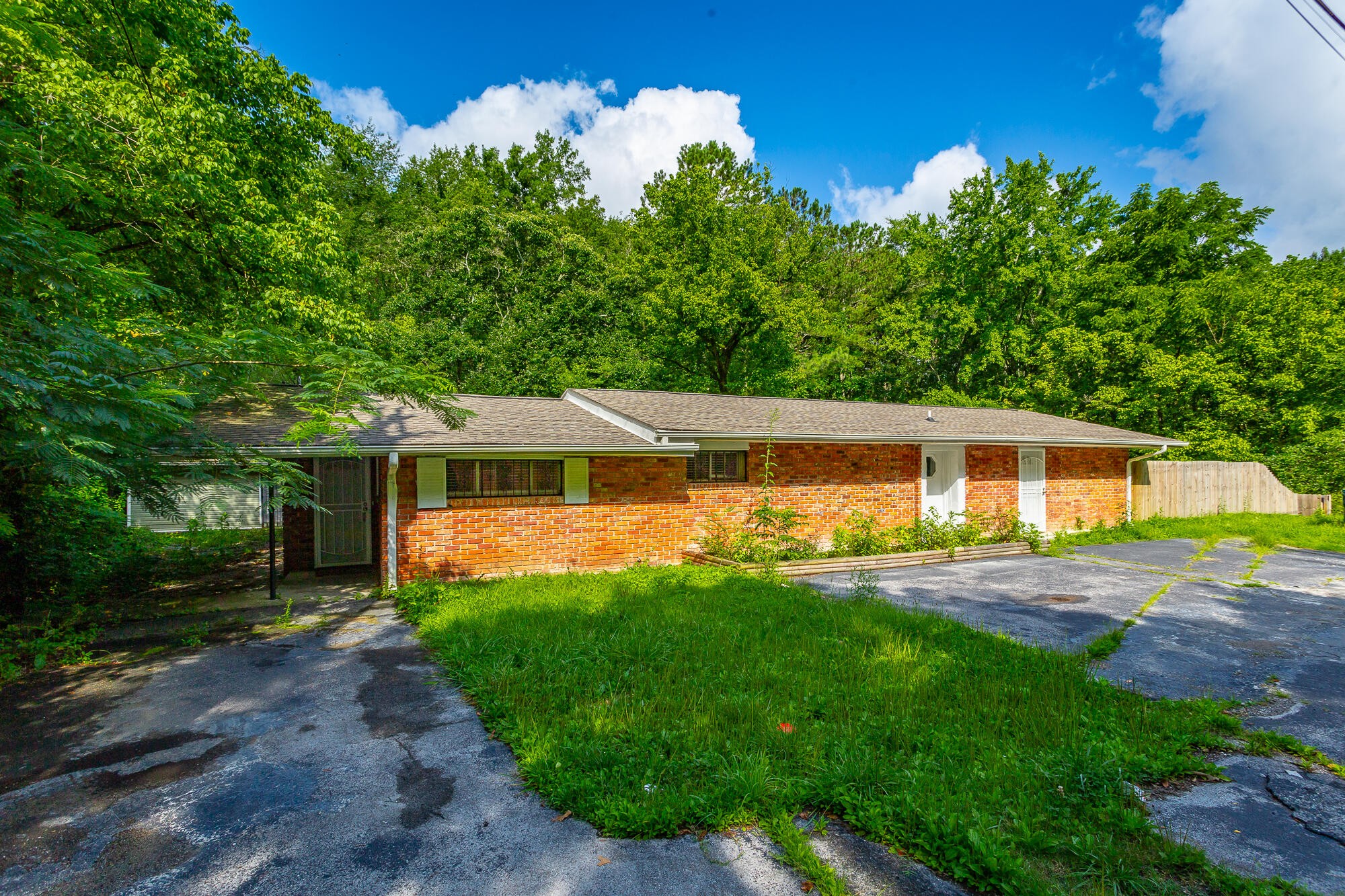 5401 Champion Road Chattanooga, TN 37416 - Photo 55 of 56 a front view of a house with a yard