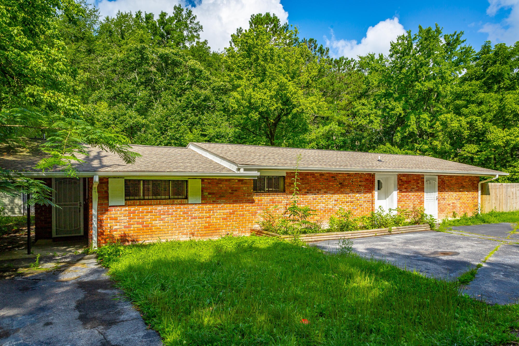 5401 Champion Road Chattanooga, TN 37416 - Photo 56 of 56 a front view of a house with a yard