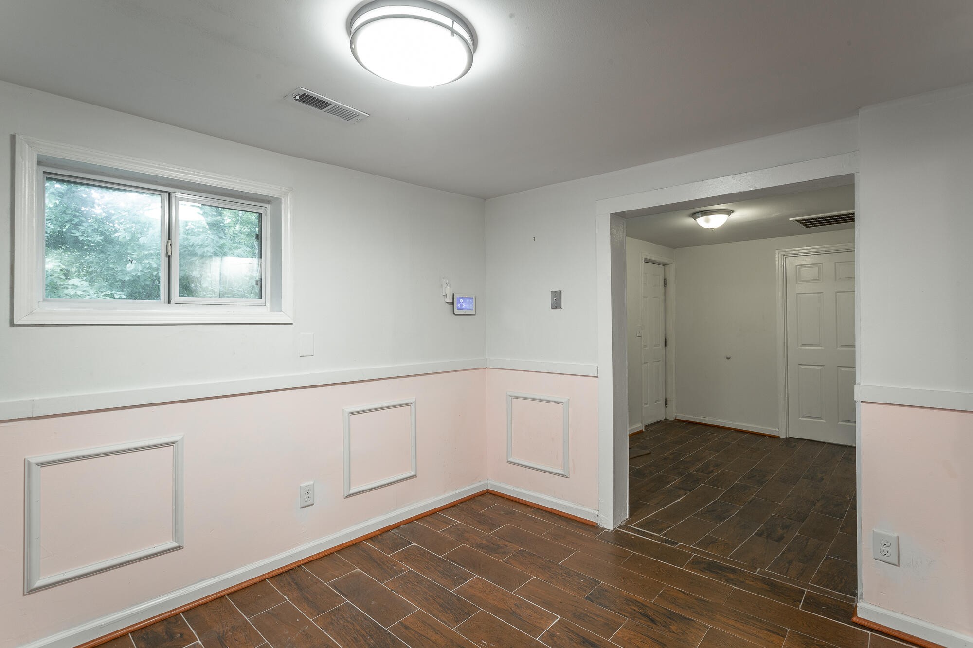 5401 Champion Road Chattanooga, TN 37416 - Photo 6 of 56 a view of an empty room with window and cabinet