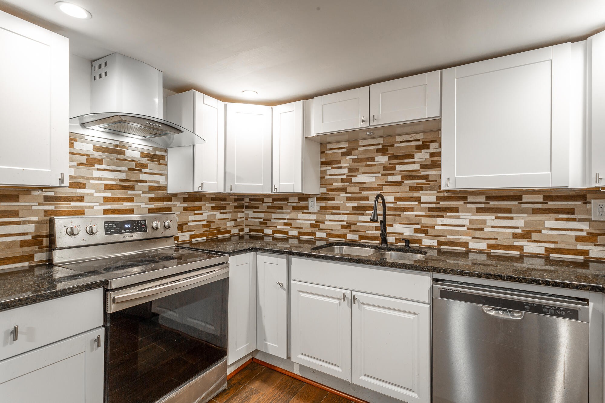 5401 Champion Road Chattanooga, TN 37416 - Photo 10 of 56 a kitchen with stainless steel appliances granite countertop a sink stove and cabinets