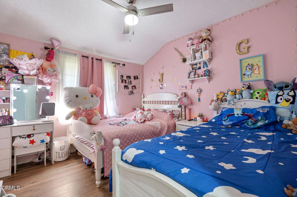 145 Homer Street Oxnard, CA 93033 - Photo 13 of 15 a bedroom with bed and furniture