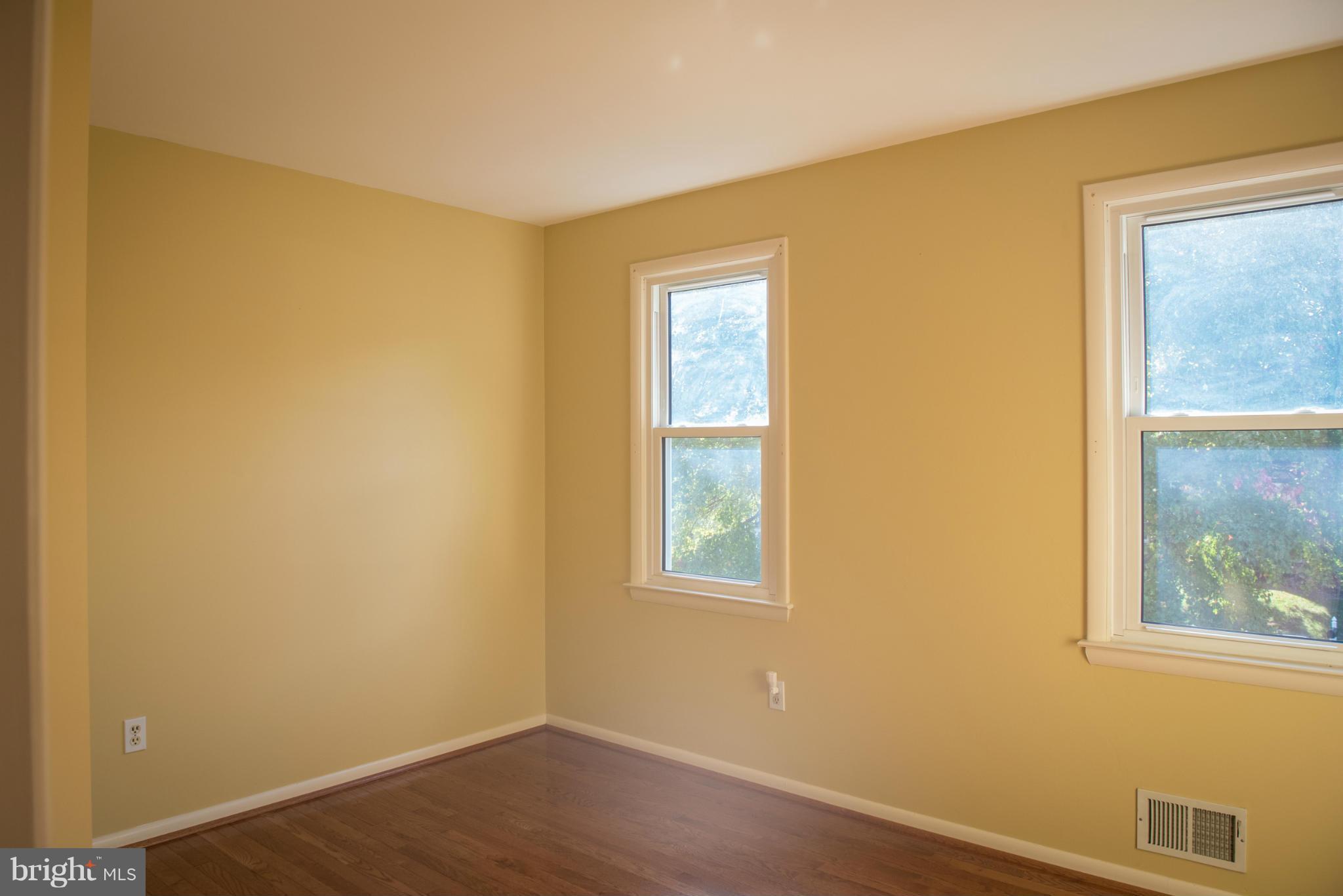 3213 Llewellyn Field Road Olney, MD 20832 - Photo 26 of 30 a view of an empty room with wooden floor and a window