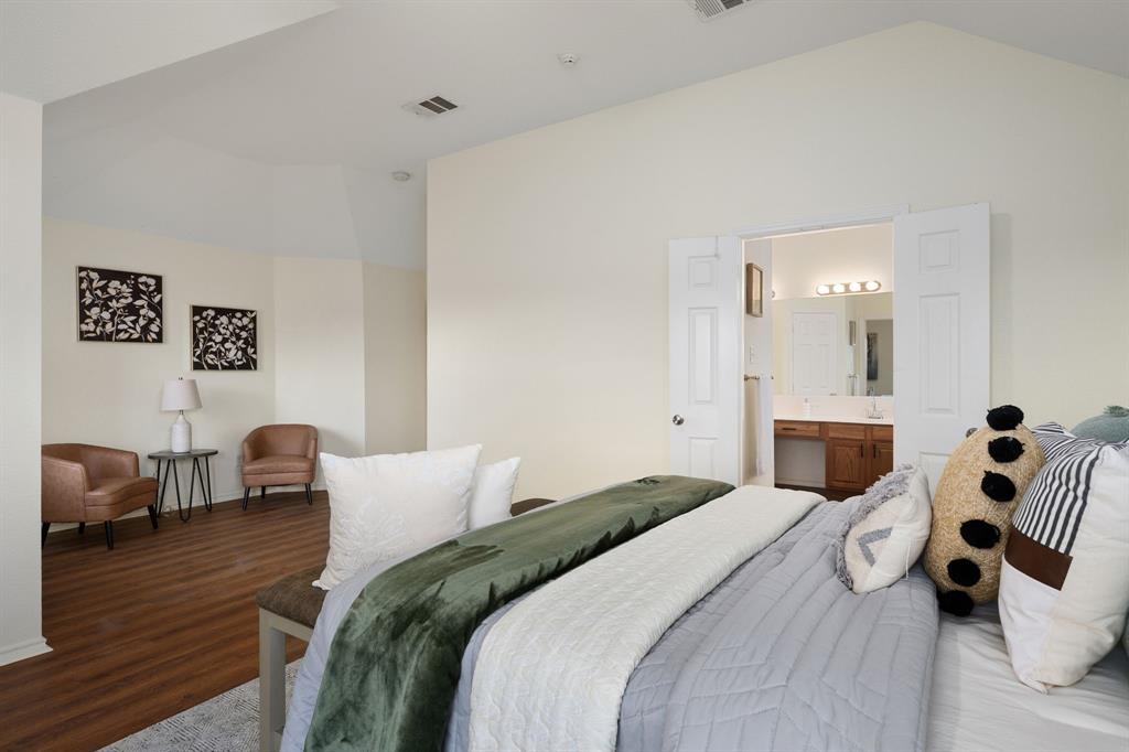 10210 Bent Tree Drive Rowlett, TX 75089 - Photo 12 of 27 a bedroom with a bed and a couch