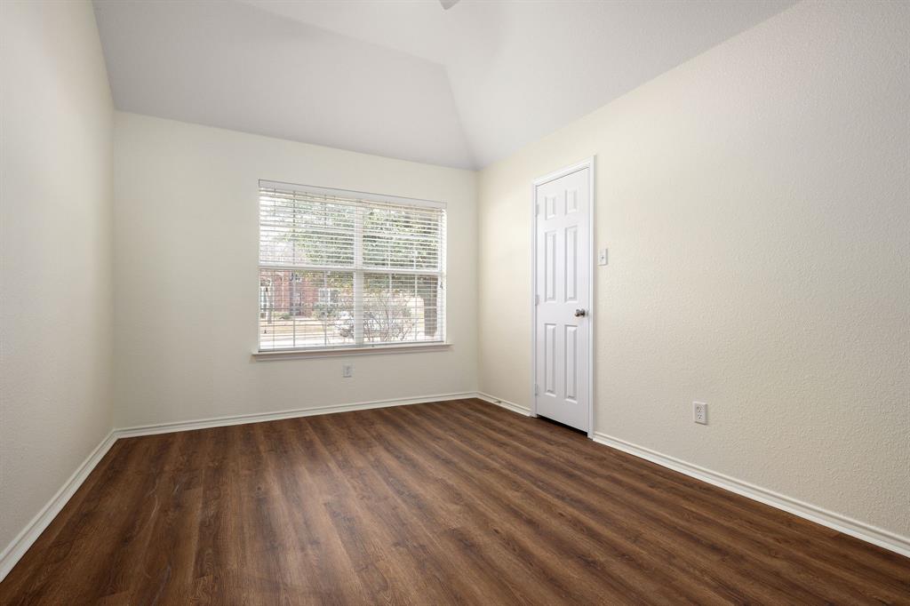 10210 Bent Tree Drive Rowlett, TX 75089 - Photo 18 of 27 an empty room with wooden floor and windows