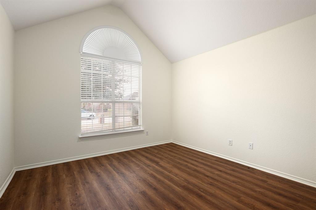 10210 Bent Tree Drive Rowlett, TX 75089 - Photo 19 of 27 an empty room with wooden floor and windows