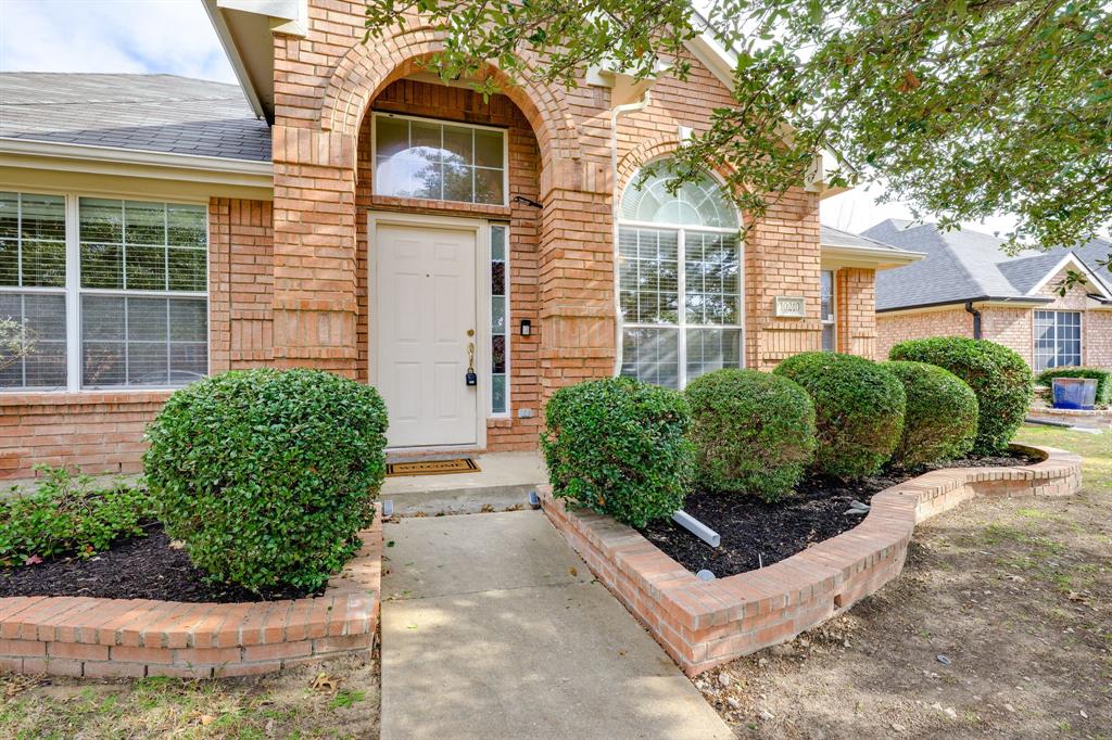 10210 Bent Tree Drive Rowlett, TX 75089 - Photo 2 of 27 a front view of a house with garden