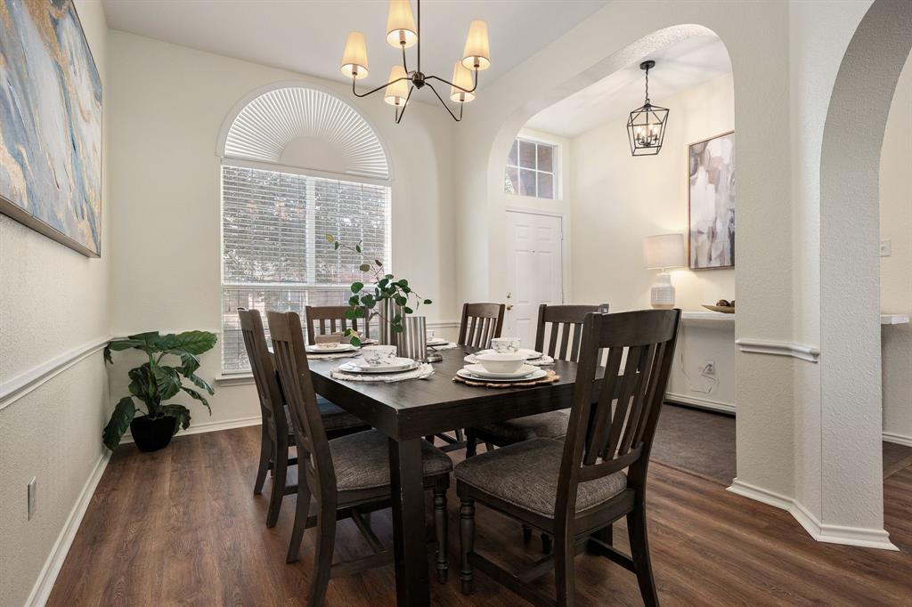 10210 Bent Tree Drive Rowlett, TX 75089 - Photo 7 of 27 a view of a dining room with furniture window and wooden floor