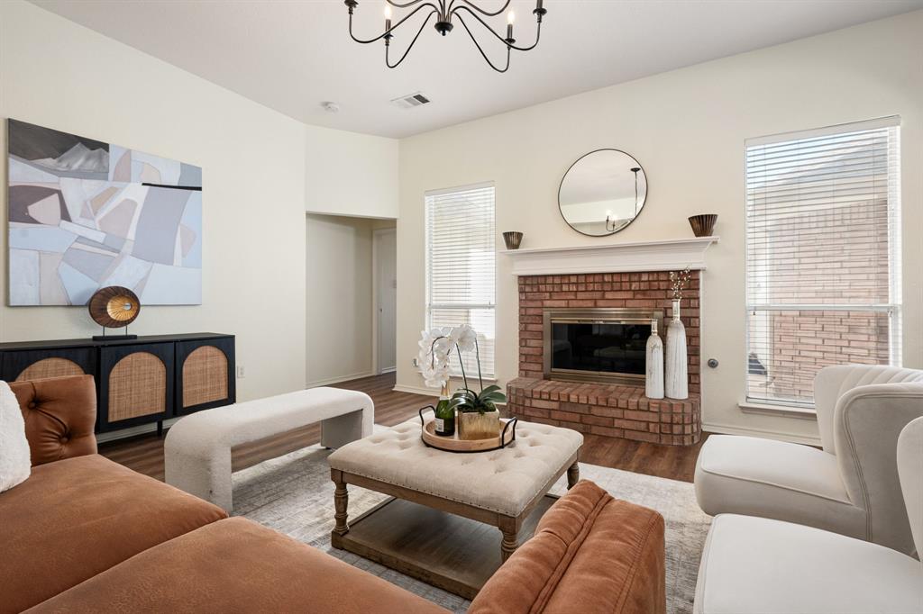 10210 Bent Tree Drive Rowlett, TX 75089 - Photo 8 of 27 a living room with furniture a fireplace and a window