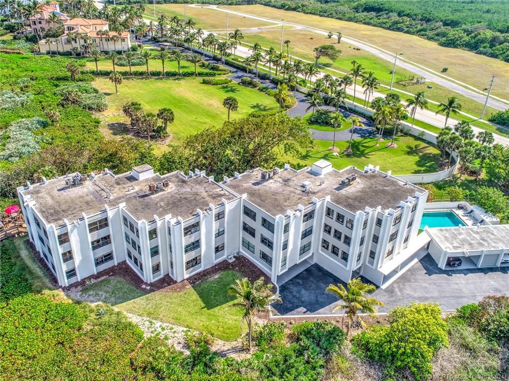 1289 Northeast Ocean Boulevard, Unit 2 Stuart, FL 34996 - Photo 26 of 41 a view of a house with a yard