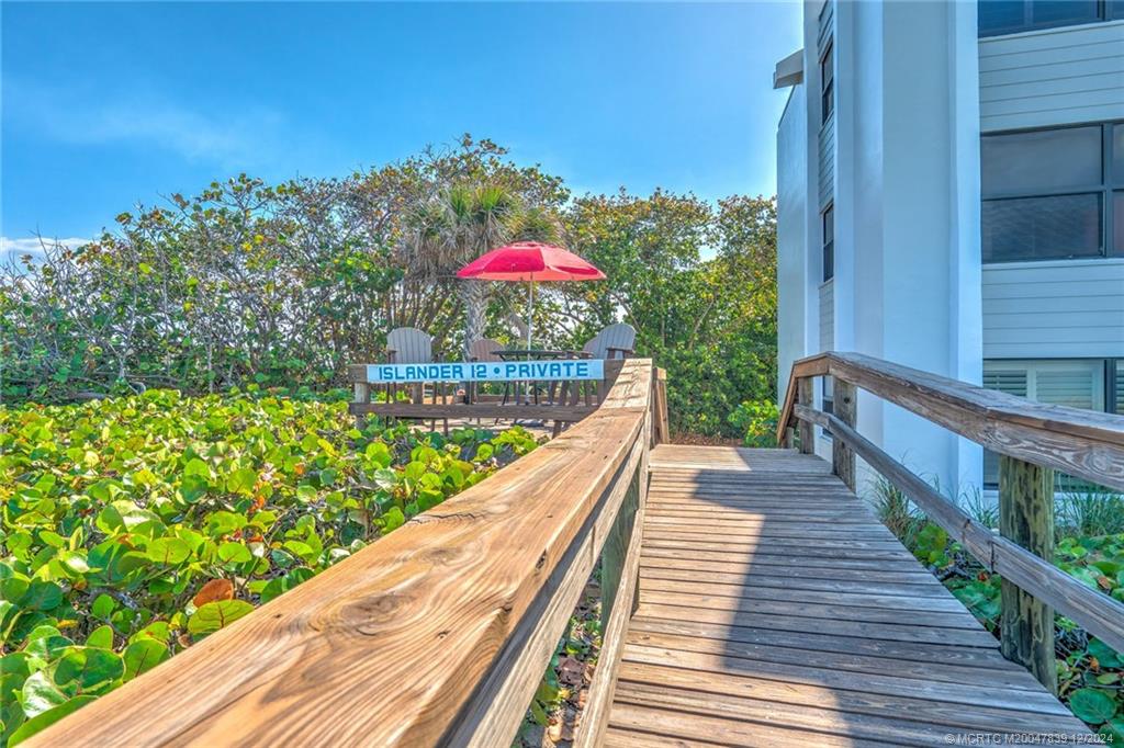 1289 Northeast Ocean Boulevard, Unit 2 Stuart, FL 34996 - Photo 34 of 41 a view of a balcony with wooden floor and city view