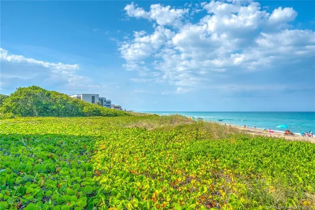 swimming pool view with a seating space