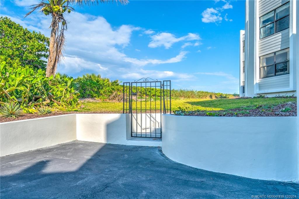 1289 Northeast Ocean Boulevard, Unit 2 Stuart, FL 34996 - Photo 40 of 41 a view of outdoor space yard and swimming pool