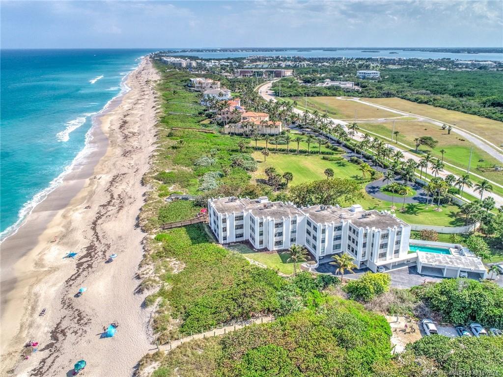 1289 Northeast Ocean Boulevard, Unit 2 Stuart, FL 34996 - Photo 5 of 41 a view of a garden with an ocean view