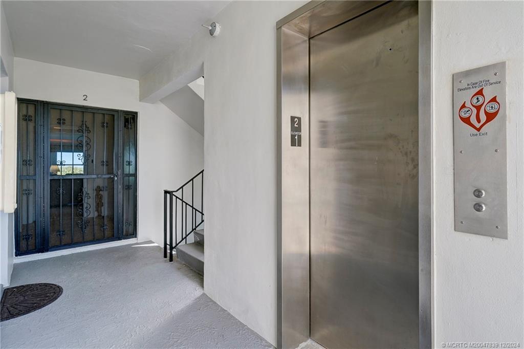 1289 Northeast Ocean Boulevard, Unit 2 Stuart, FL 34996 - Photo 7 of 41 a view of a hallway with elevator