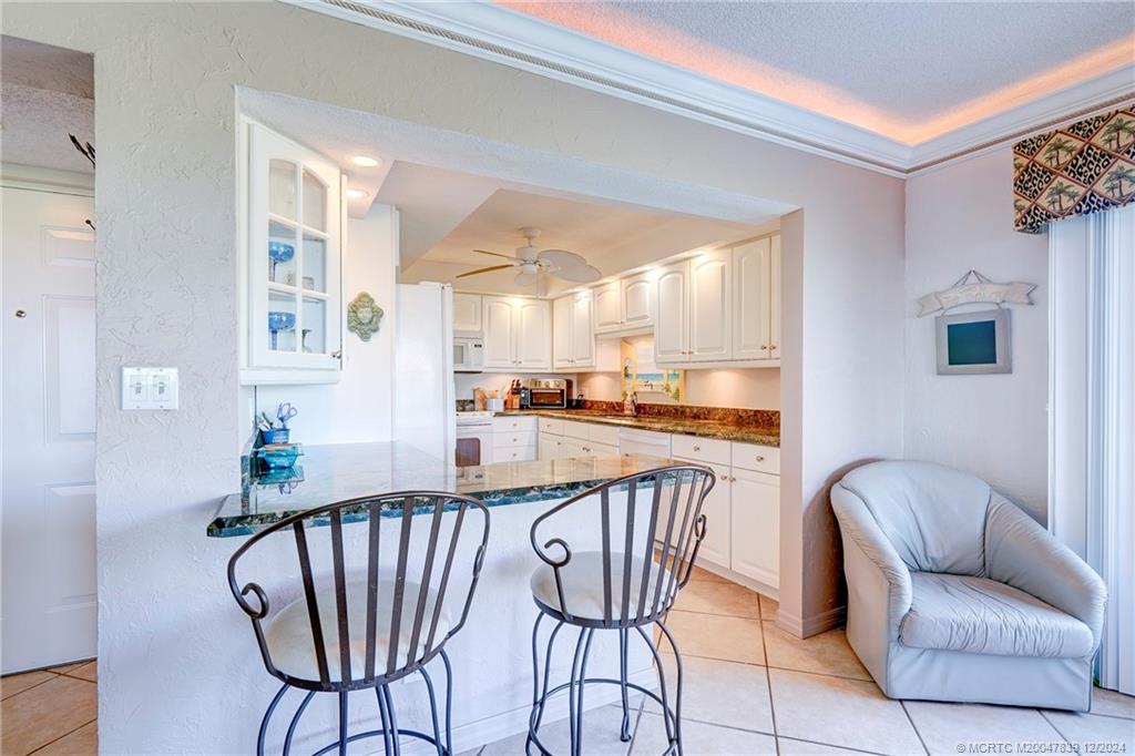 1289 Northeast Ocean Boulevard, Unit 2 Stuart, FL 34996 - Photo 10 of 41 a outdoor space with furniture