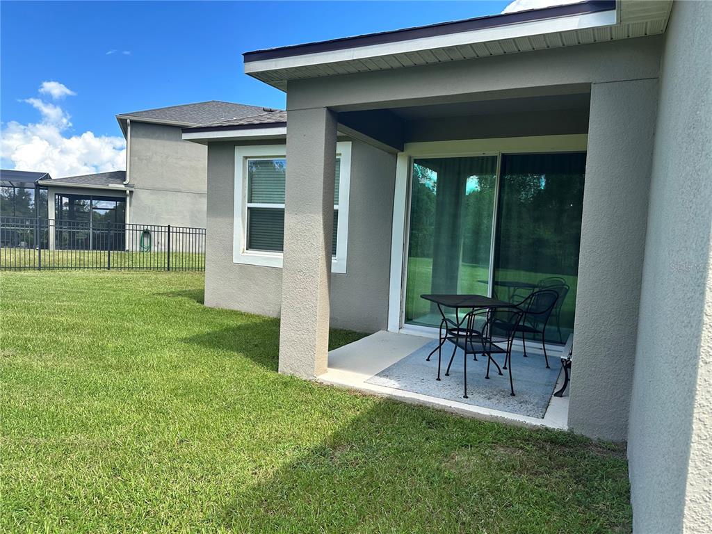 2337 Farnham Drive Ocoee, FL 34761 - Photo 14 of 20 a view of an house with backyard and porch