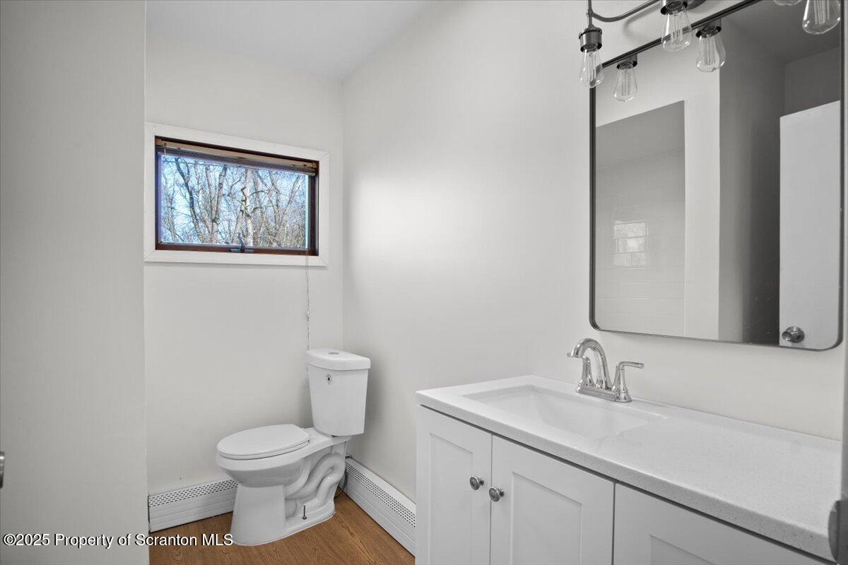 134 Lampman Street Avoca, PA 18641 - Photo 13 of 34 a bathroom with a toilet sink and mirror
