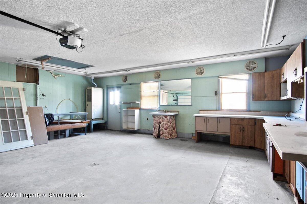 134 Lampman Street Avoca, PA 18641 - Photo 25 of 34 a kitchen with a sink and a stove top oven