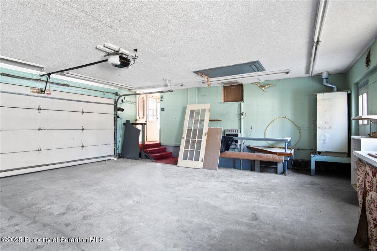 134 Lampman Street Avoca, PA 18641 - Photo 31 of 34 a view of a livingroom with furniture and a ceiling fan