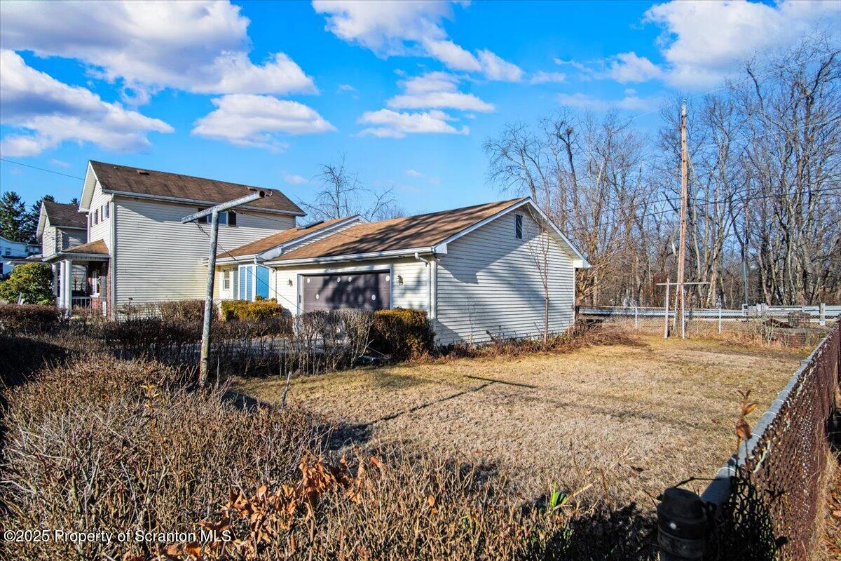 134 Lampman Street Avoca, PA 18641 - Photo 32 of 34 a view of a house with a yard