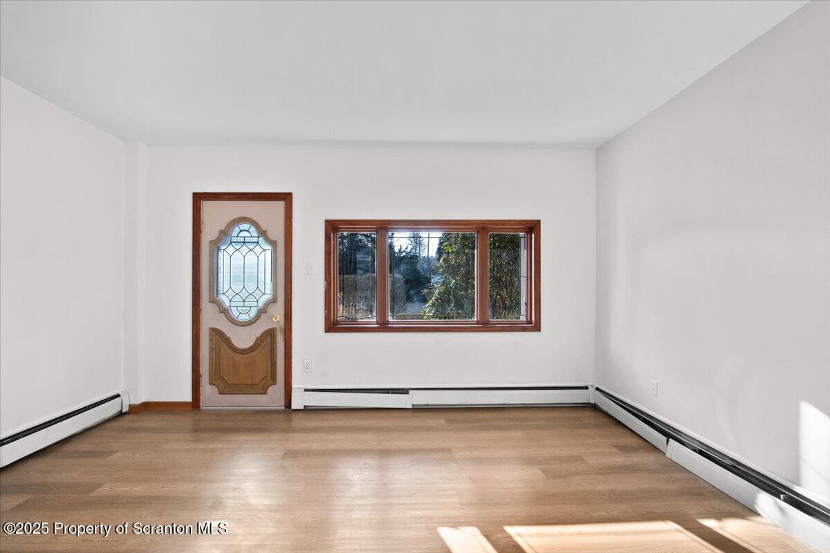 134 Lampman Street Avoca, PA 18641 - Photo 8 of 34 a view of empty room with window and dryer