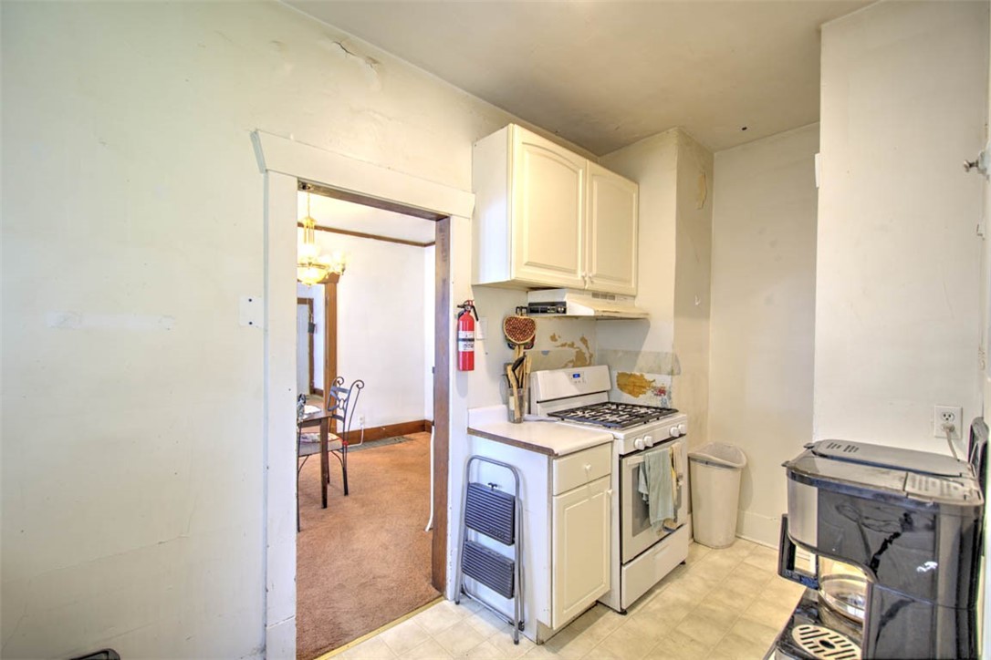 739 West Cushing Street Decatur, IL 62526 - Photo 15 of 28 a kitchen that has a stove and a refrigerator