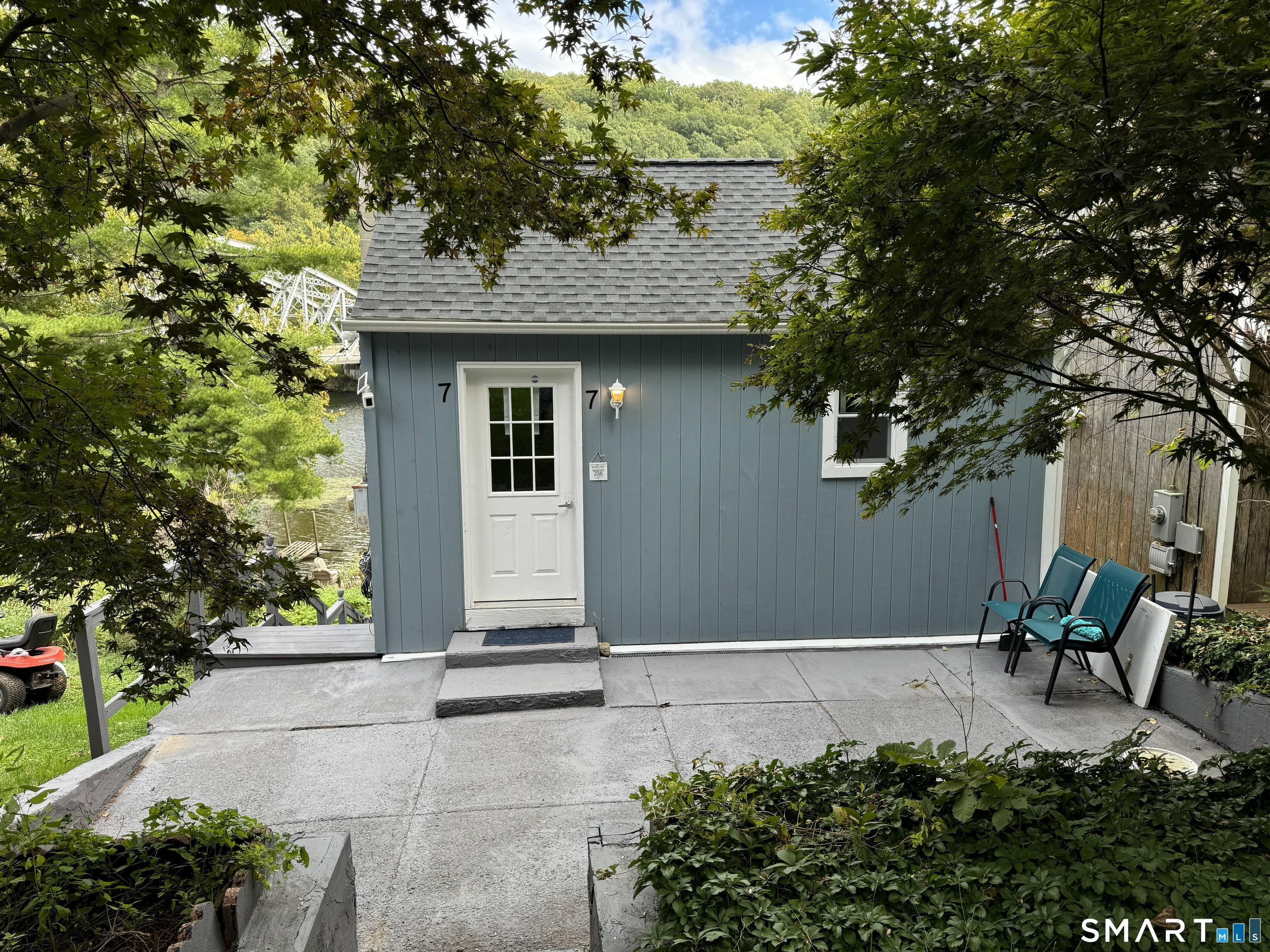 7 Pootatuck Park Road Newtown, CT 06482 - Photo 23 of 25 a front view of a house with garden