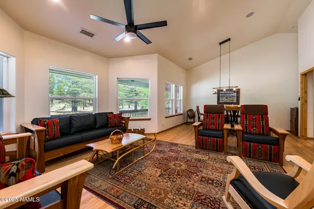 a view of a room with large windows