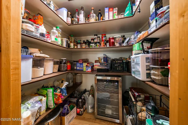 a backyard of a house with fountain table and chairs